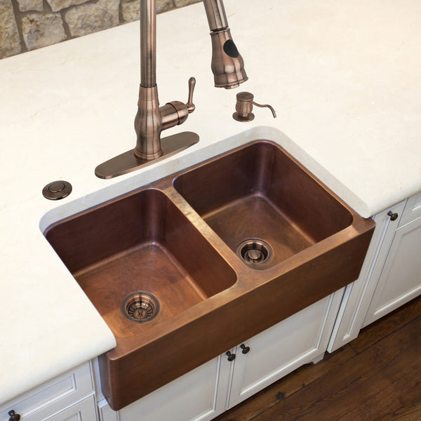 Copper kitchen sink with faucet in a home setting