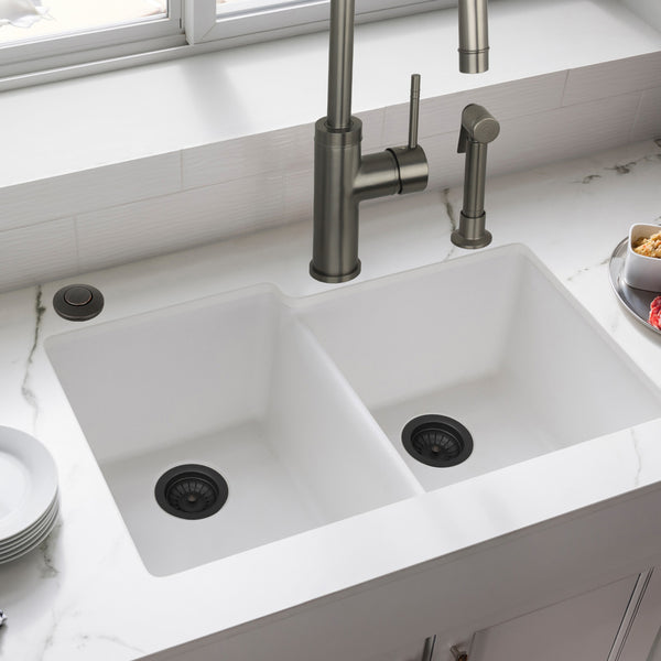 White kitchen sink with silver faucet in a modern kitchen setting