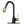 A Two-Tone Matte Black & Gold Pull Out Kitchen Faucet with Deck Plate, showing the faucet in a bent position with gold-colored accents and a single lever handle.