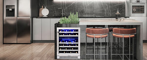 Modern kitchen with a wine cooler, bar stools, and marble countertop.