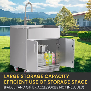 Outdoor kitchen sink with storage cabinet and accessories on a grassy area with a lake and mountains in the background.