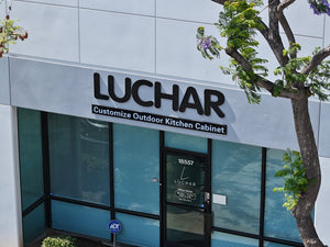 Building exterior with 'Luchar' branding and outdoor kitchen cabinet customization service.