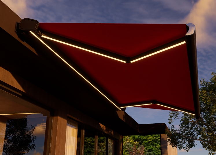 Red retractable awning with LED lights against a blue sky