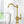 A single-handle brushed gold drinking water filter faucet with a high arch and traditional design.