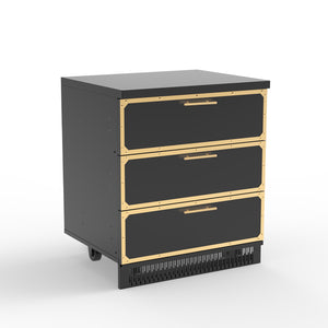 A stainless steel outdoor kitchen cabinet with three drawers, featuring black and gold color scheme.